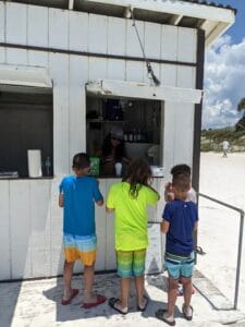 Saving For Backpacking Travel in Southeast Asia: Working Beach Service Making Snow Cones