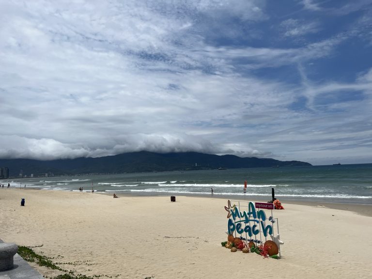 My An Beach sign on sandy shore, Đà Nẵng, Vietnam.